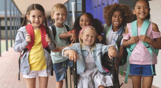 Group of children smiling at children